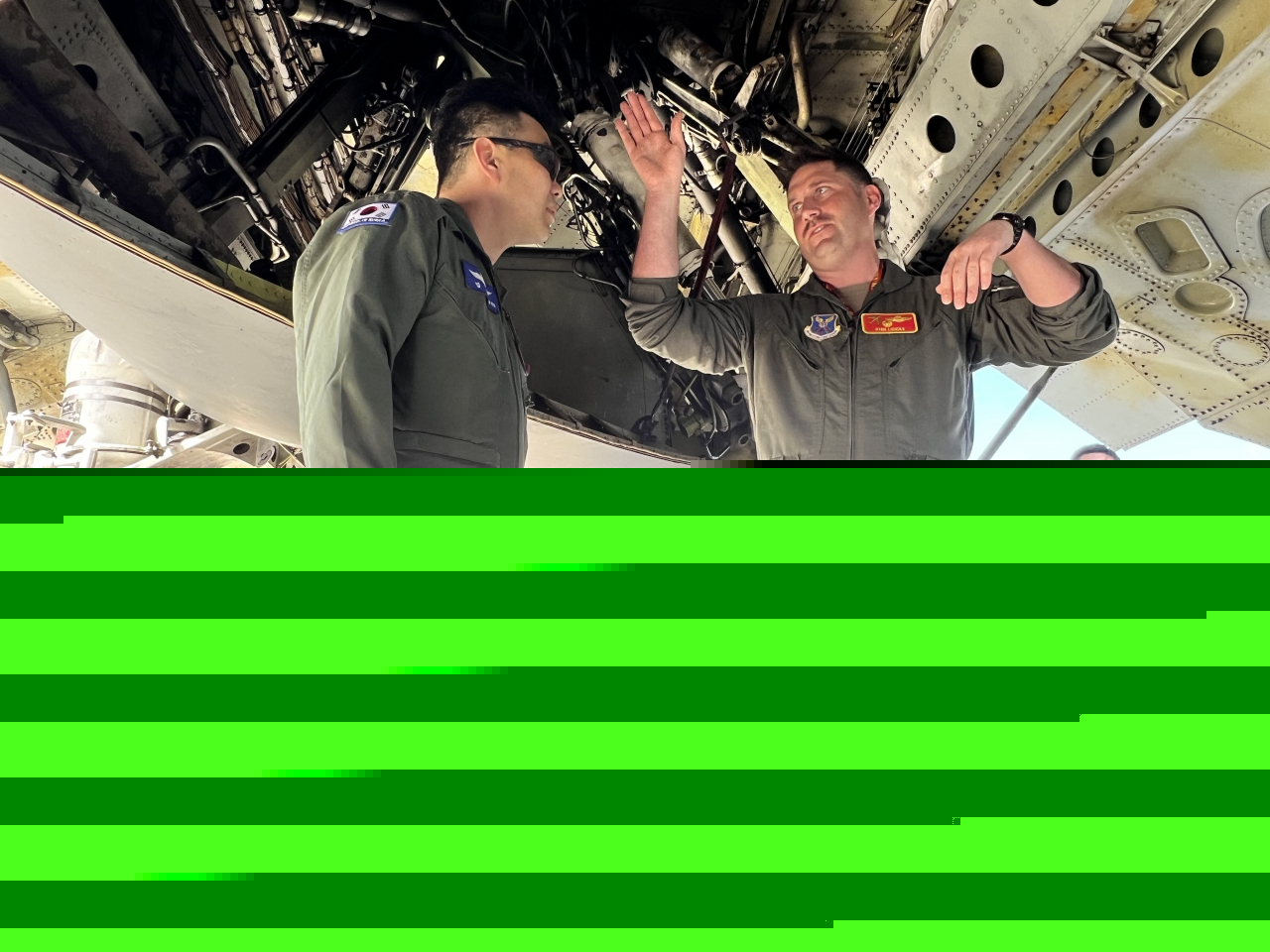US Air Force Lt. Col. Ryan Lockes, 23rd Expeditionary Bomb Squadron commander, explained to Republic of Korea Air Force Col. Kim Seoun Kyu, B-52 operations during a static tour of the aircraft at Andersen Air Force Base, Guam, Feb. 13, 2024. (US Air Force)