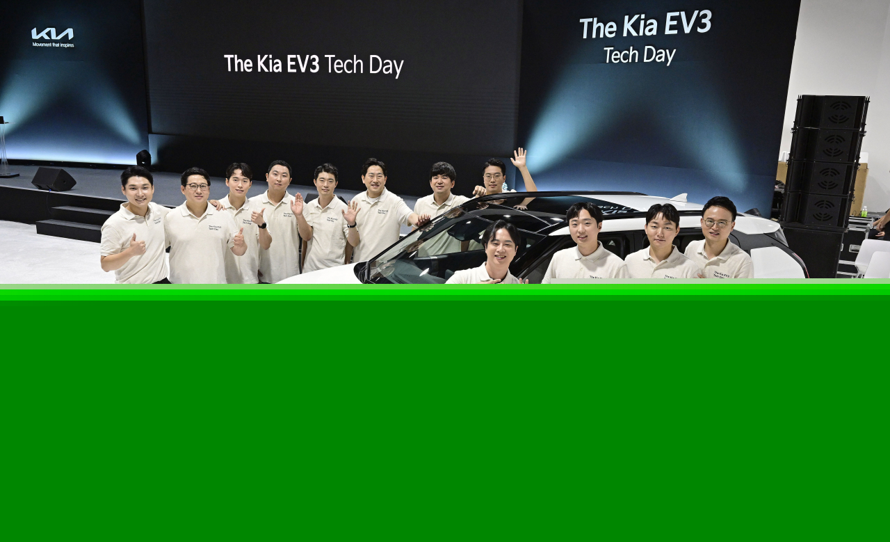 Kia engineers pose for a photo with the Kia EV3 at a studio in Seoul on Tuesday. (Hyundai Motor Group)