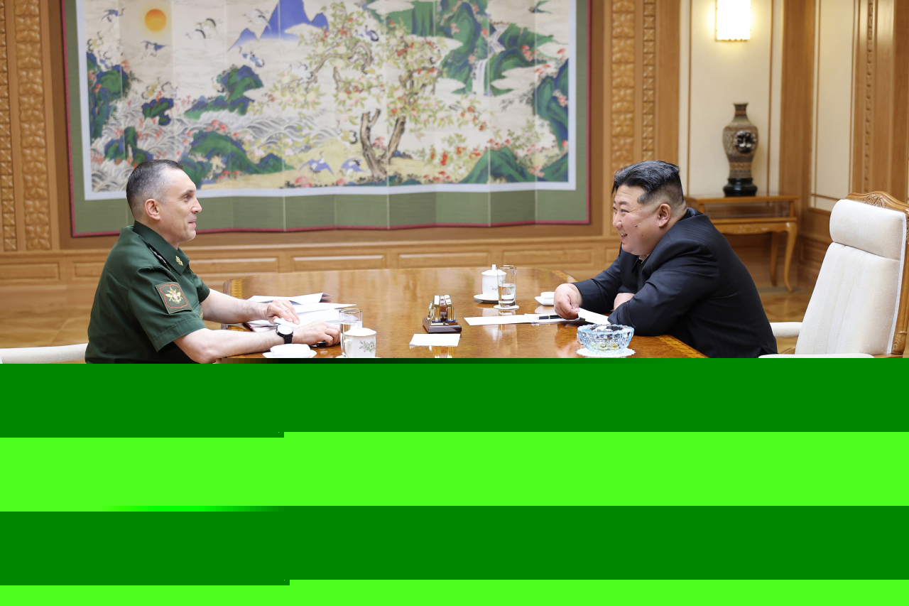 This photo, carried by North Korea's official Korean Central News Agency on June 19, 2024, shows the North's leader Kim Jong-un (right) meeting with Russian Vice Defense Minister Aleksey Krivoruchko in Pyongyang the previous day. (KCNA)