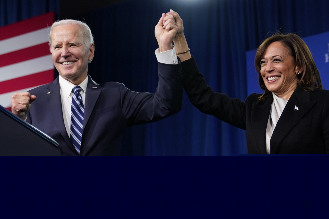 President Joe Biden (left) and Vice President Kamala Harris stand on stage at the Democratic National Committee winter meeting, on Feb. 3, 2023, in Philadelphia. (AP)