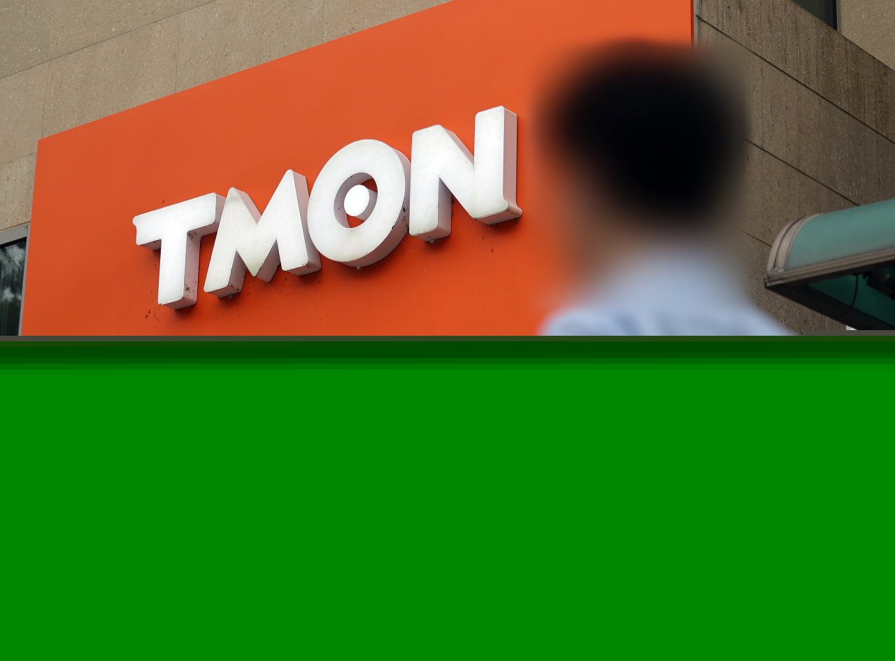 A person walks by Tmon headquarters in southern Seoul on Monday. (Yonhap)