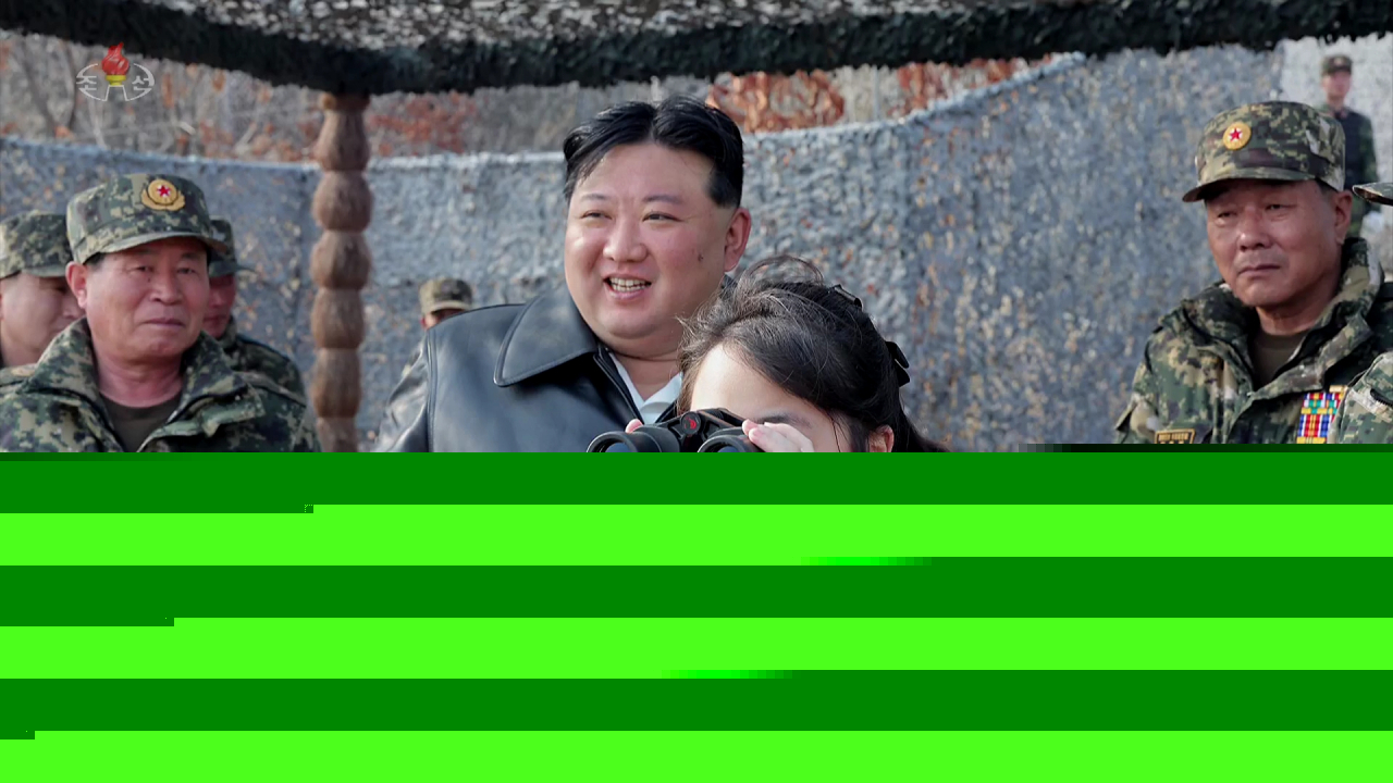North Korean leader Kim Jong-un (center) and his daughter Ju-ae inspect a military base in North Korea in March. (A screen capture of Korean Central Television via Newsis)