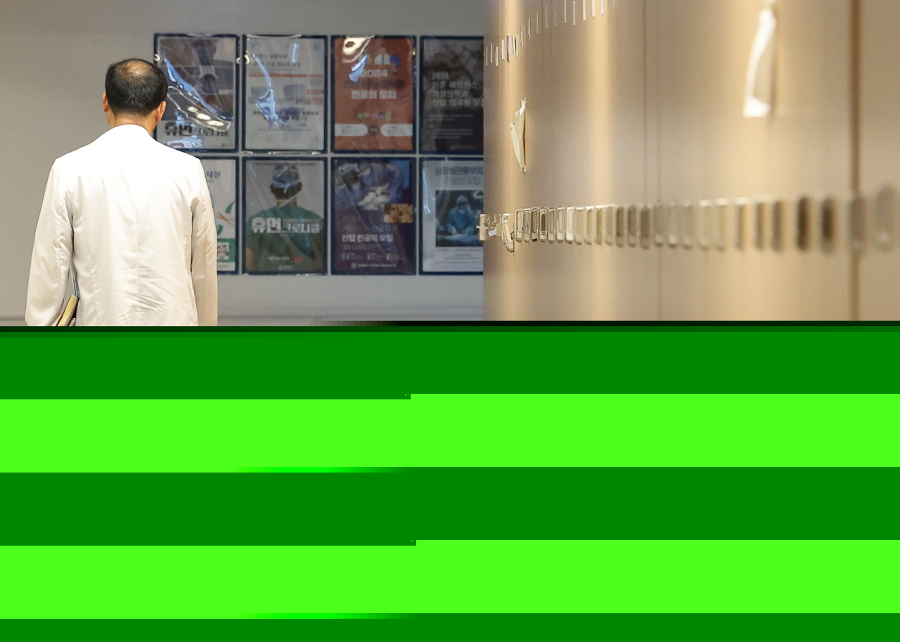 A medical worker walks in a hallway at a general hospital in Seoul on Monday. (Yonhap)