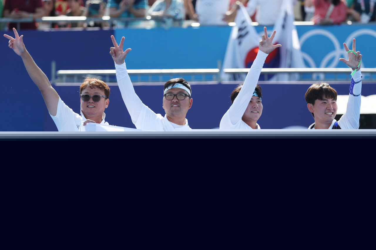 The South Korean men's archery team cheers after winning the gold medal in the men's team event Monday at the Paris Olympics. (Yonhap)
