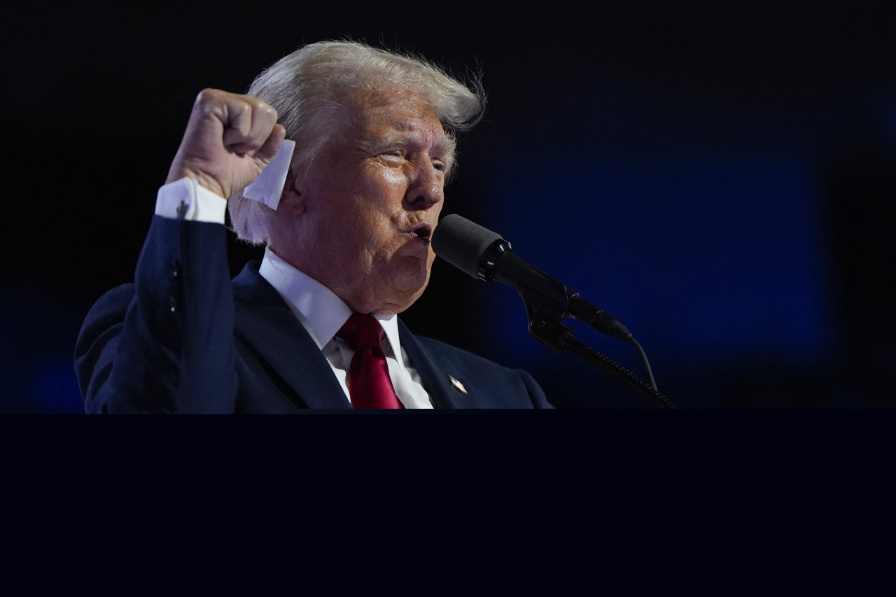 Republican presidential nominee and former US president Donald Trump raises his fist while speaking at the Fiserv Forum in Milwaukee, Wisconsin, on July 18, during the fourth day of the Republican National Convention. (Reuters-Yonhap)