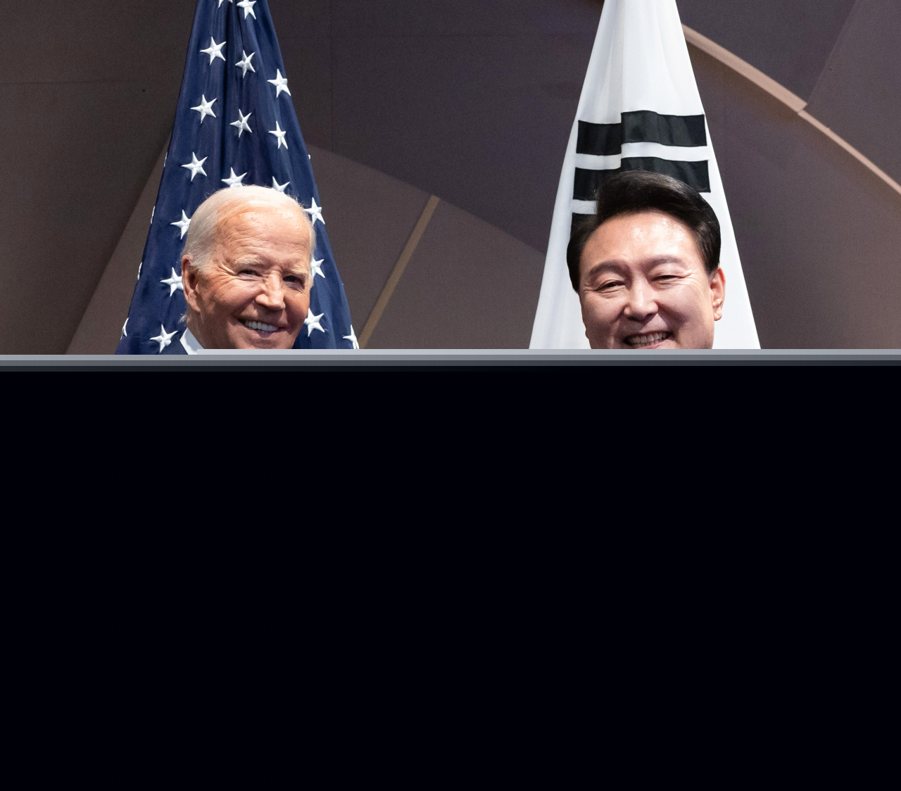South Korean President Yoon Suk Yeol (right) and US President Joe Biden shake hands during their meeting held on the sidelines of the North Atlantic Treaty Organization (NATO) summit held in Washington D.C. on July 11. (Pool photo via Yonhap)